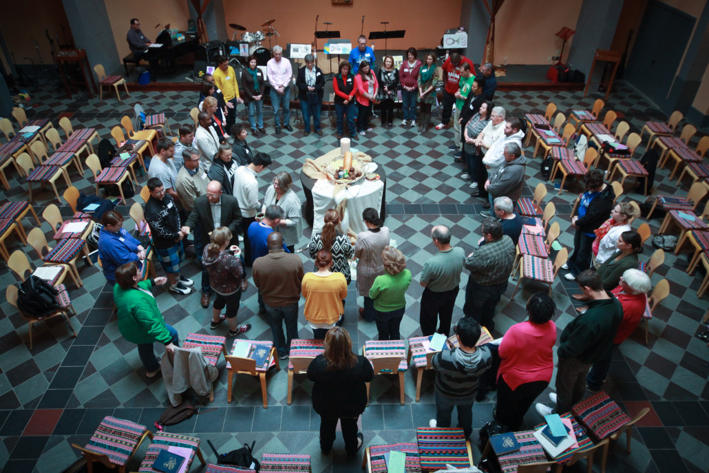 large group gathers in circle during spiritual formation retreat