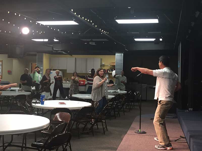 Performer at Methodist Ministry Course of Study Talent Show engaging his audience