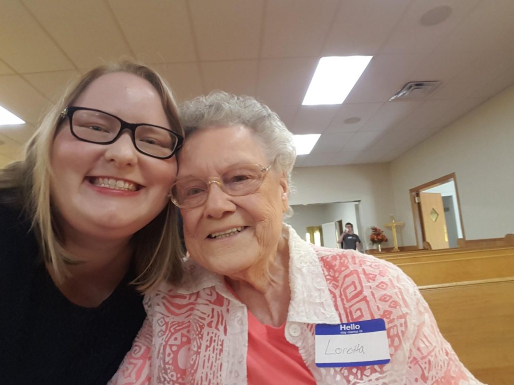 MDiv Shannon Rodenberg pictured with congregant.