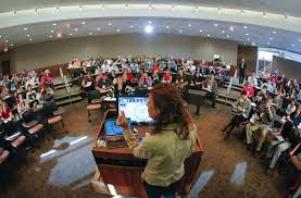 professor leads a leadership class on SPST's Kansas location