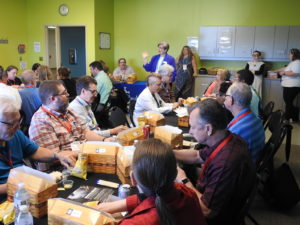 Alumni enjoying a meal at a reunion