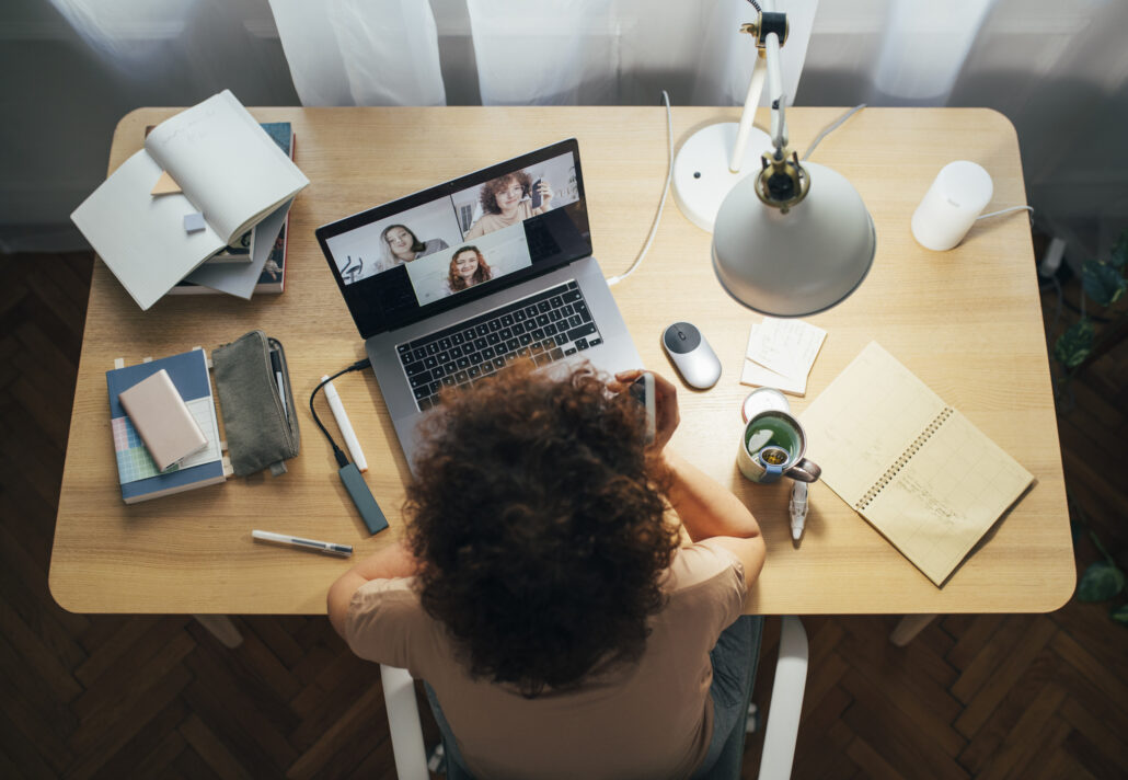 Overhead view of female MDiv student participating in online class