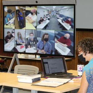 Student interacting with seminary class through Neat Board