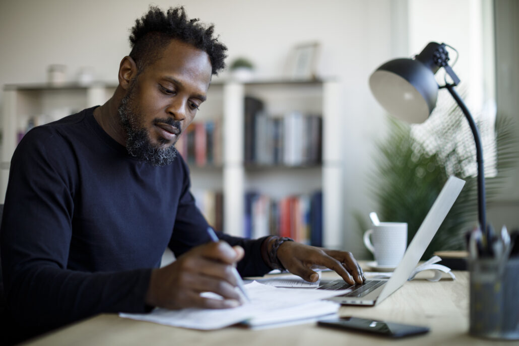 Male student working on thesis research